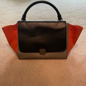 Used Black grey and orange tricolor medium trapeze